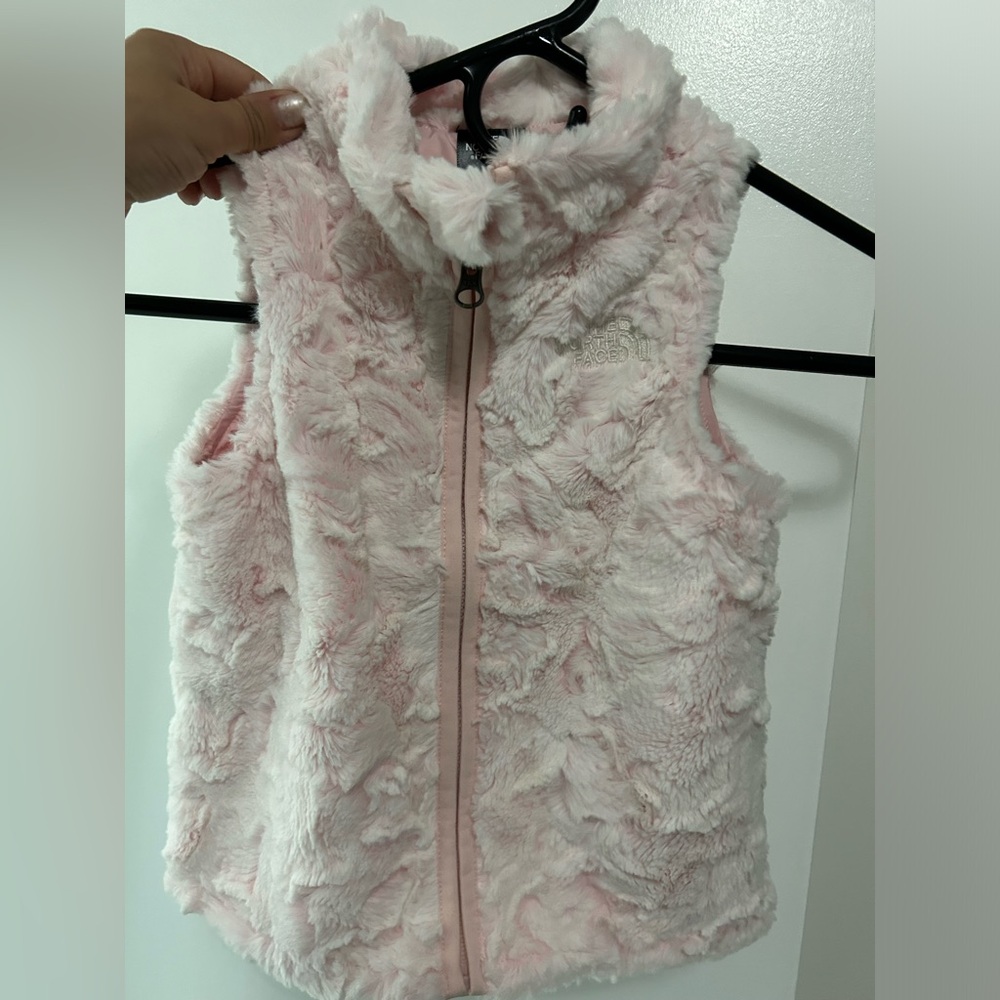 Brand new condition (no tags but never worn) north face pink fuzzy vest!